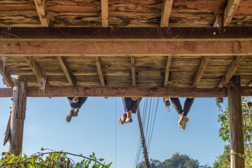 Obraz premium Tourists group sitting hanging legs on terrace