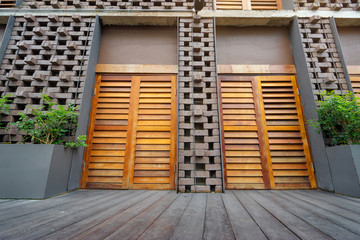 Architecture and design. Brick facade with wooden doors.