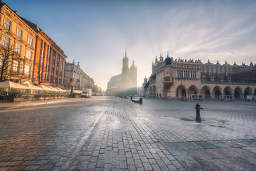 Fototapeta Krakow old town, Market square, St. Mary's church (Mariacki cathedral) and Cloth Hall at sunrise, wide-angle view cityscape, Poland, Europe obraz