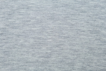 gray fluffy woven thread sweater as a background.
