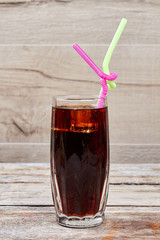 Glass with coke and straw.