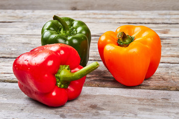 Sweet pepper on wooden backdrop.