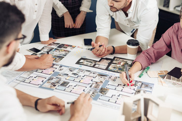 Close up hands of professional architects discussing the project