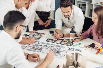 Team of architects working on construction plans