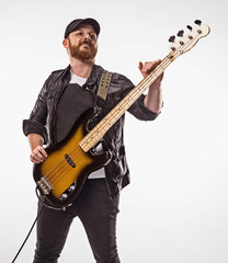 Obraz premium Bassist plays bass guitar.