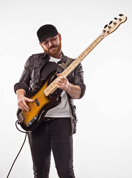 Bassist plays bass guitar.