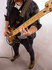 Obraz na płótnie Canvas Bassist plays bass guitar.