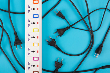 Messy of electrical cords plugs and wires unconnected electrical power strip or extension block ...