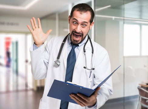 Shocked Doctor Reading A Document