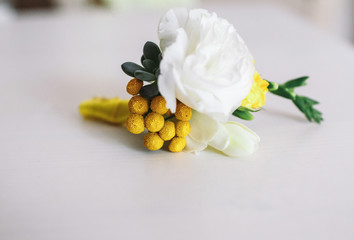 White wedding boutonniere made from flowers
