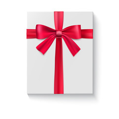 White package with a large red bow. A holiday gift box close-up, top view isolated on white background. Vector white square gift box with shiny red satin bow, ribbon.
