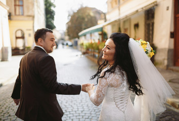 Happy and beautiful couple on the street