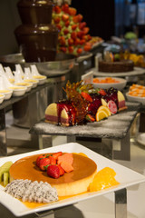 Chocolate fountain with fruit skewers