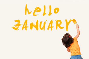Cute little girl drawing : hello JANUARY with painting brush on wall background