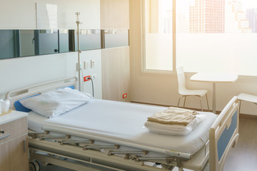 Modern hospital room with bed and medical equipment
