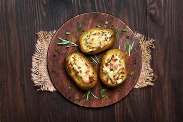 Baked potatoes with bacon, green onion and cheese