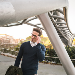 Young handsome man posing in an urban context