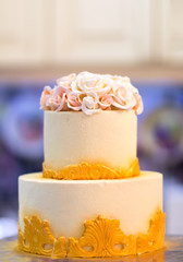 Festive wedding cake with flowers, yellow-orange flowers, bunk, beautiful, gentle