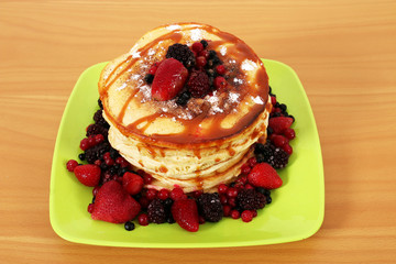 pancakes with fruit on table