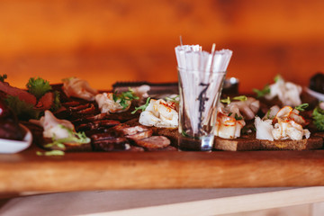 Delicious meat lies on the wooden dish