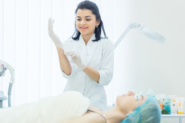 Young female doctor with female patient in clinic