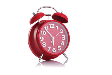 Red alarm clock on white background