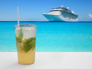 Refreshing summer cocktail with cruise ship in background.