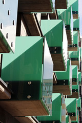 detail of modern green glass balcony during suny day
