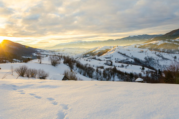 Fototapeta na wymiar Dawn sunlight Winter morning. A view of the winter mountains. Wi
