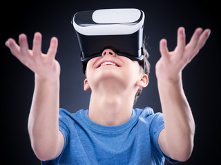 Teen boy in VR glasses