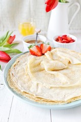 Coconut pancakes with strawberries and caramel