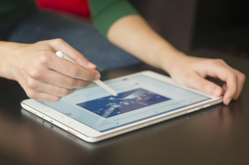 Woman Using Tablet With Smart Pen