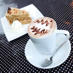 Coffee and cake on polka dot table