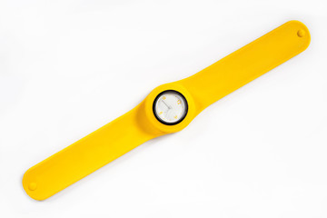 Yellow watch on a flexible yellow thong is isolated on a white background
