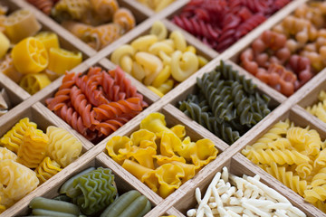 Variety of types, colors and shapes of Italian pasta. Dry pasta