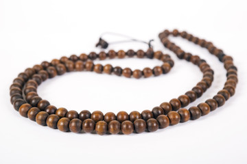 Wooden beads  are isolated on a white background
