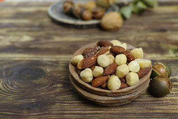 Roasted salted nuts mix, snack from macadamia, walnotes and almonds