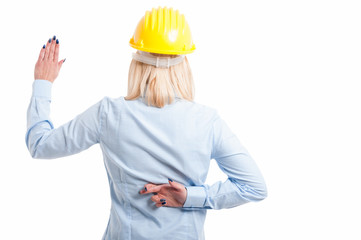 Back view of lady engineer taking fake oath