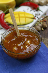 Bowl of homemade Mango Chutney on old wooden table