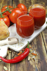 Raw Organic red Tomato Juice with salt, basil and bread