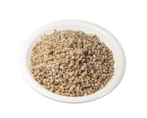 Boiled buckwheat in a plate on a white background