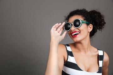 Portrait of smiling beautiful african american young woman in eyeglasses