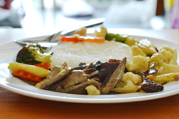 stir fried mixed vegetable with pork liver on rice