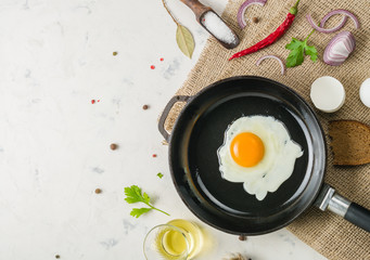 Morning in the kitchen. Cooking breakfast. Fried egg. Light background