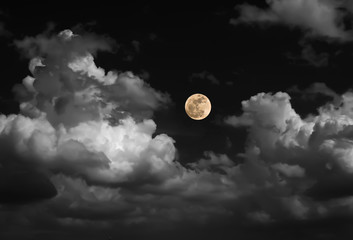 blur moon on black and white sky with cloud
