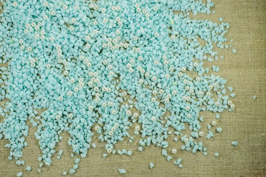 Blue gravel with pearl beads. - Powered by Adobe