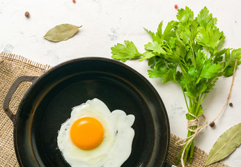 Morning in the kitchen. Cooking breakfast. Fried egg. Light background
