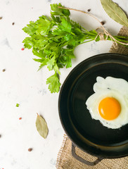 Morning in the kitchen. Cooking breakfast. Fried egg. Light background