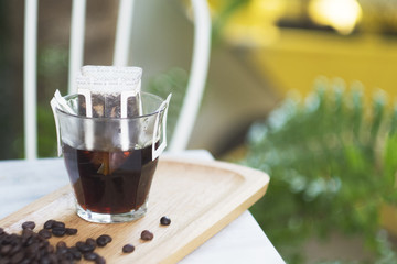 Hand drip coffee, puring water on coffee ground with filter