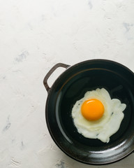 Morning in the kitchen. Cooking breakfast. Fried egg.